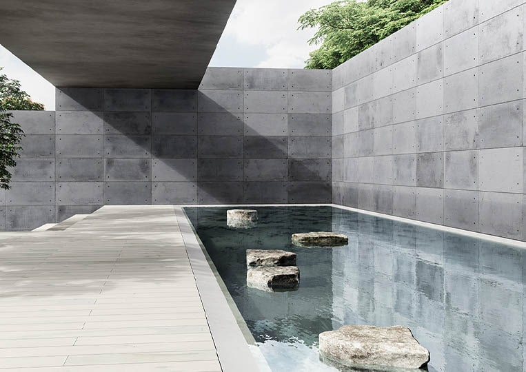 Terasse extérieure et piscine encerclé par un mur en pierre reconstituée acl hando plus gris